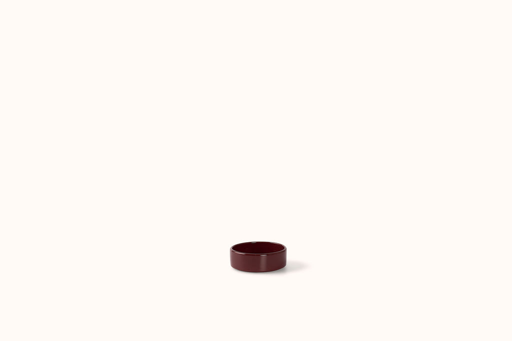 BERGS POTTER BURGUNDY GLAZED HOFF SAUCER