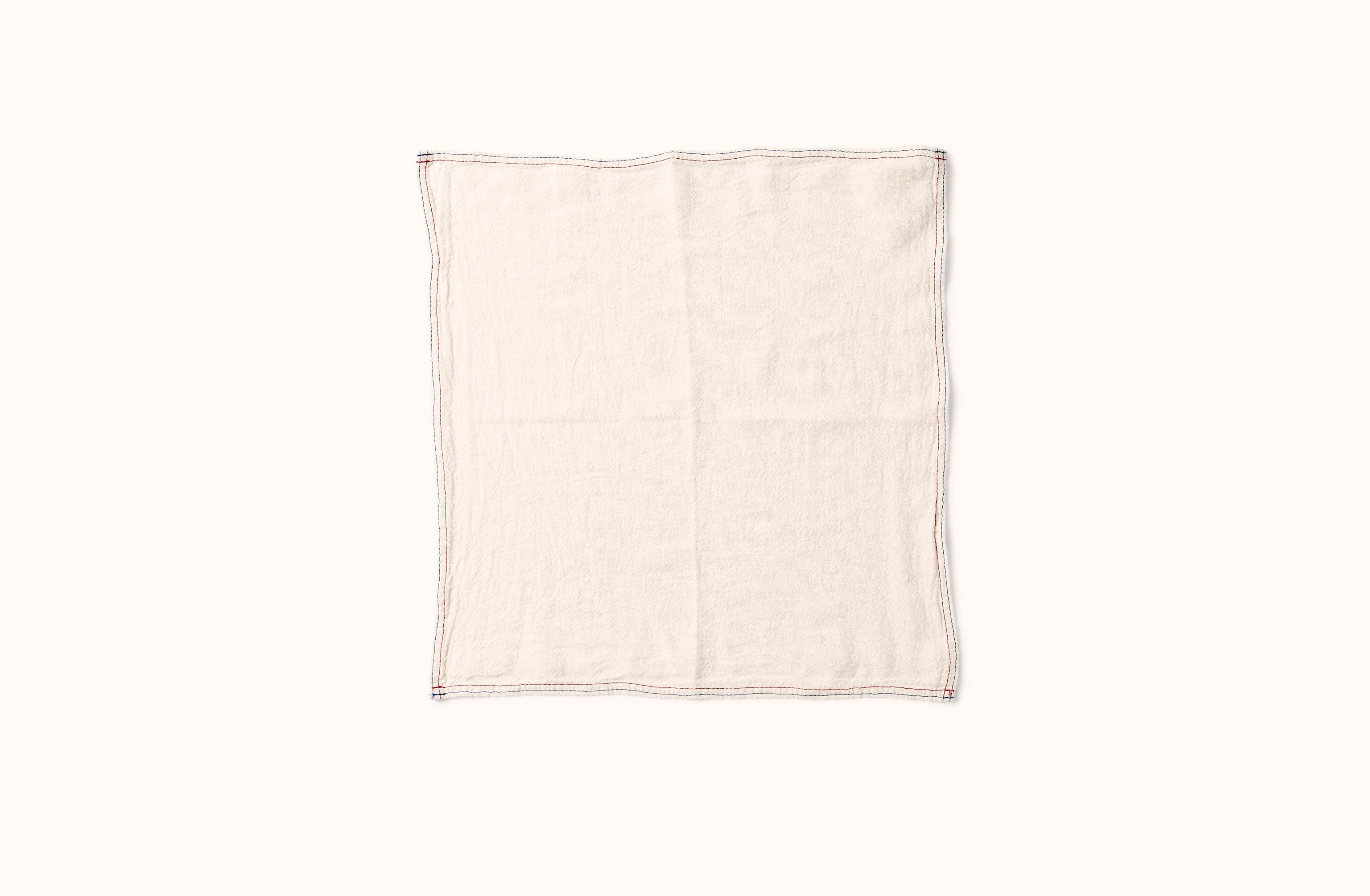 CHARVET BLUE AND RED EMBROIDERED STRIPE BORDER ON WHITE LINEN NAPKIN